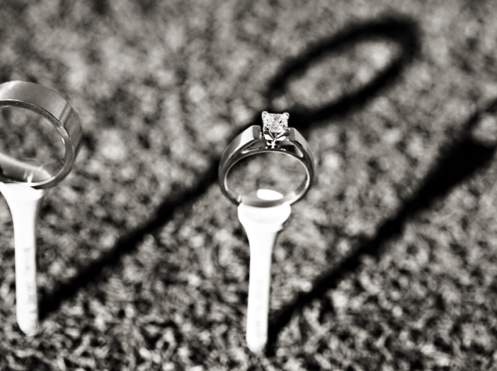 wedding rings on golf tees.