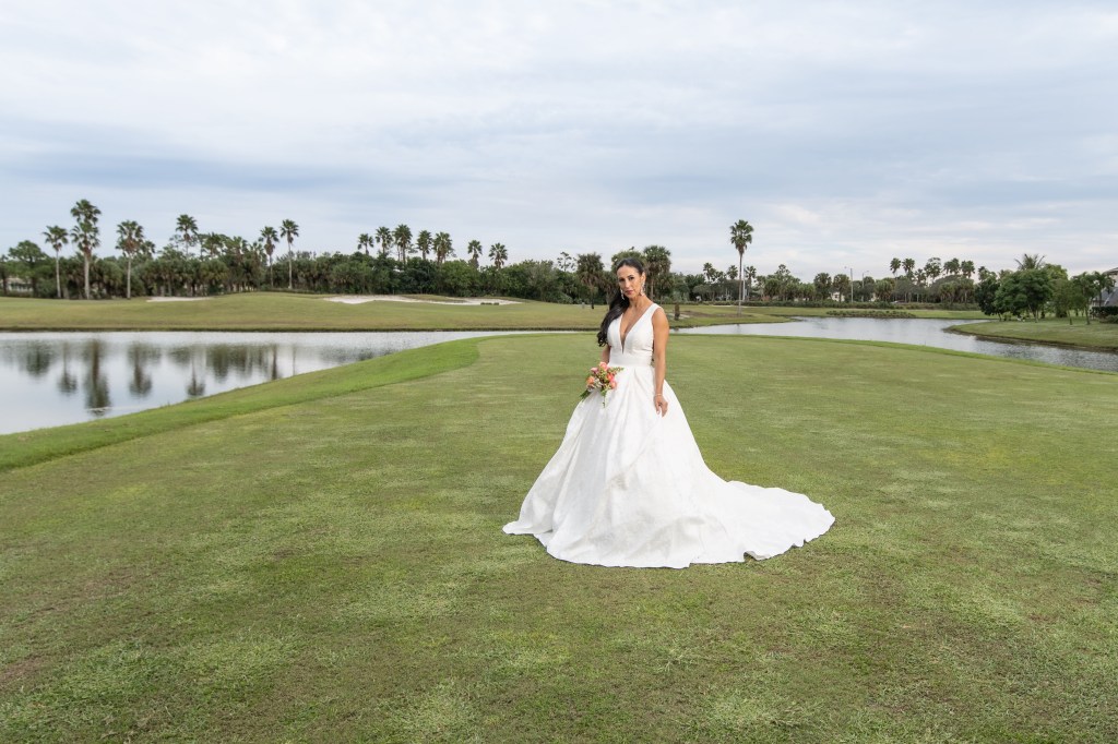 Palm Beach country club wedding venue with outdoor ceremony and bride posing for photos