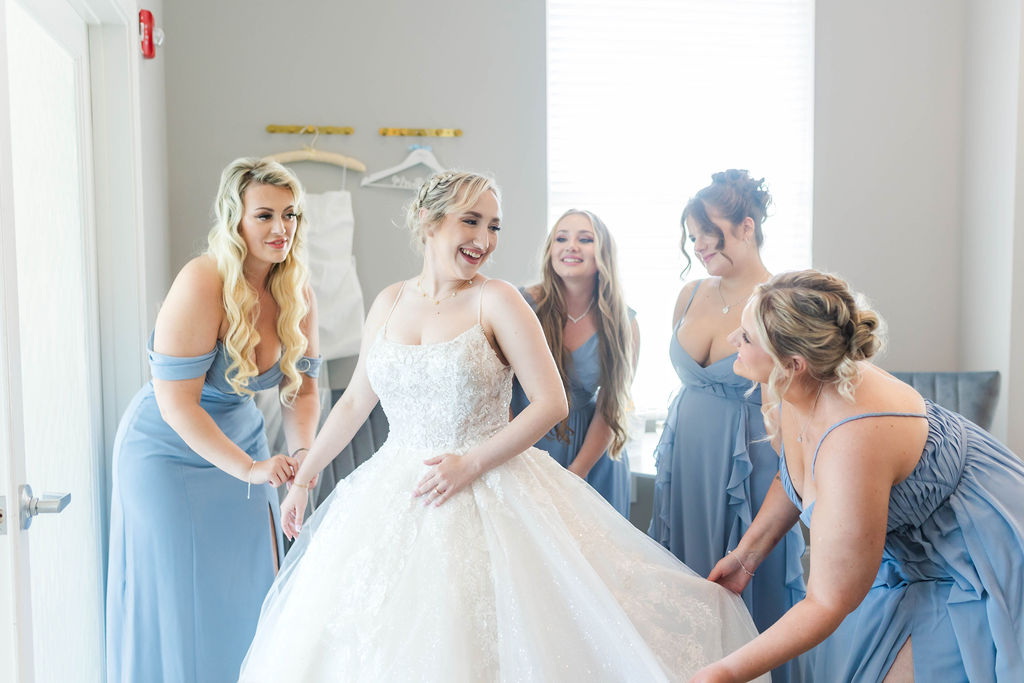 Palm Beach Florida wedding venue dressing suite with bride & bridesmaids getting ready at a country club wedding venue in Southern Florida