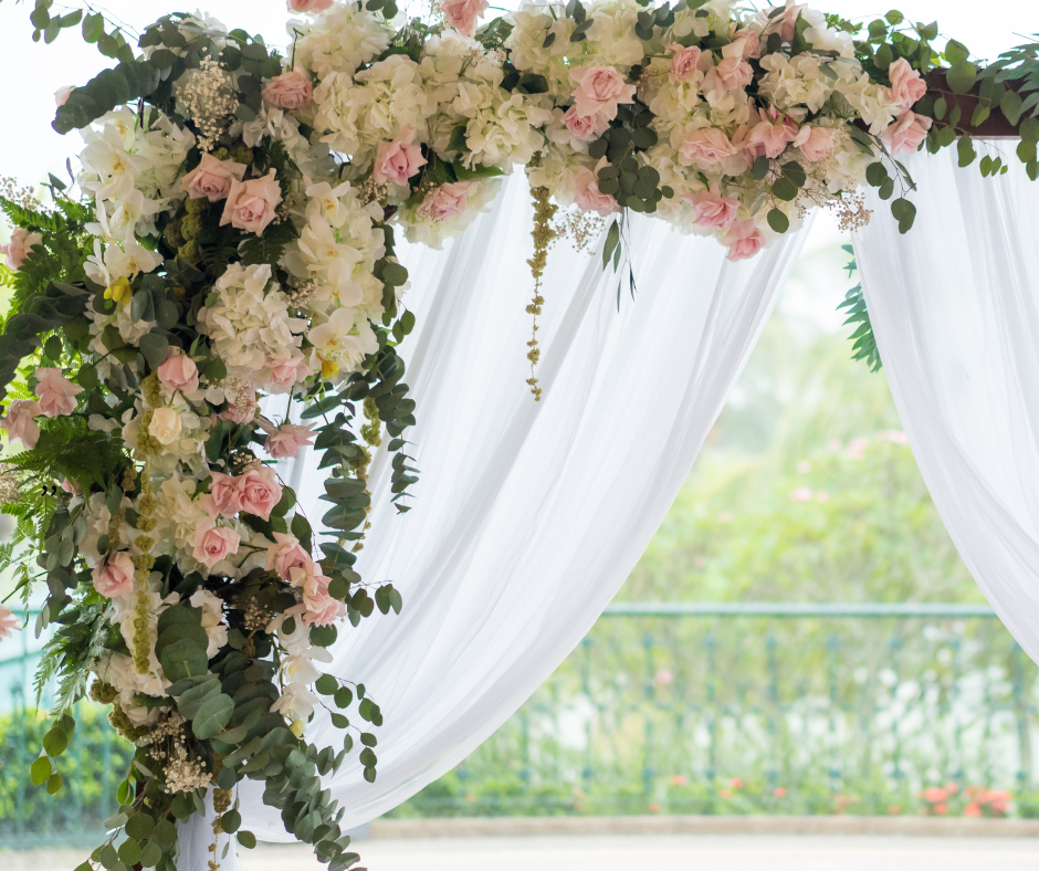 luxury wedding ceremony flowers, wedding ceremony arch covered in flowers at a Palm Beach wedding venue